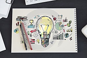 Hand-drawn light bulb with business and creativity icons on spiral notebook, wooden desk background, concept of brainstorming. 3D