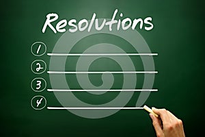 Hand drawn RESOLUTIONS blank list concept on blackboard