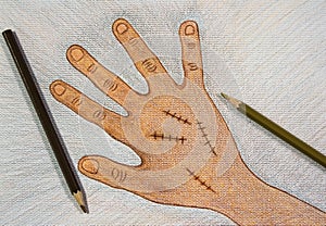 Hand drawn right hand with surgical wound suture by wooden color pencils on white paper background on table,Halloween concept.