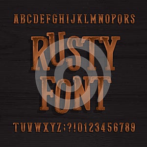 Hand drawn rusty vintage typeface. Retro alphabet font. Type letters and numbers on a rough wooden background.
