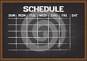 Hand drawn schedule on chalkboard.