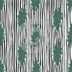 Hand drawn seamless pattern with green oak leaves in doodle style. Black and white striped background