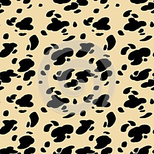 Hand drawn black and yellow seamless pattern stylized animal skin Dalmatians. Can be used for design on fabric, wallpaper photo