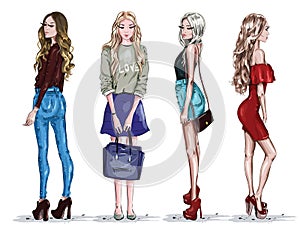 Hand drawn set with beautiful young women in fashion clothes. Stylish girls. Sketch.