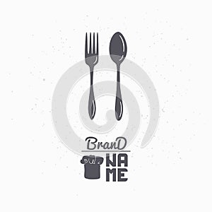 Hand drawn silhouette of spoon and fork. Restaurant logo template for craft food packaging, menu or brand identity