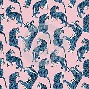 Hand drawn tiger seamless pattern, big cats in different position, blue tigers on pink, exotic background, flat vector