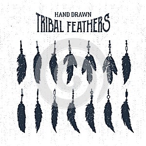 Hand drawn tribal style feathers set. Vector illustration