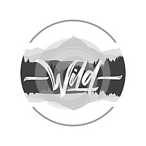 Hand drawn type lettering of Wild with silhouette of mountains lake landscape