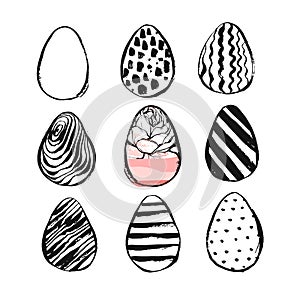 Hand drawn vector abstract Easter brush painted eggs collection set with floral motif in black and white colors isolated