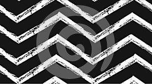 Hand drawn vector abstract rough geometric monochrome seamless zig zag chevron pattern in black and white colors.Hand