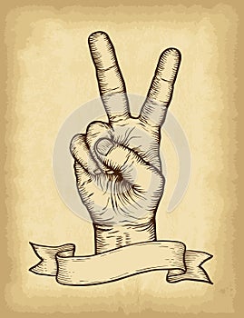 Hand drawn victory hand gesture with ribbon banner. Old paper texture background. Engraved style vector illustration.