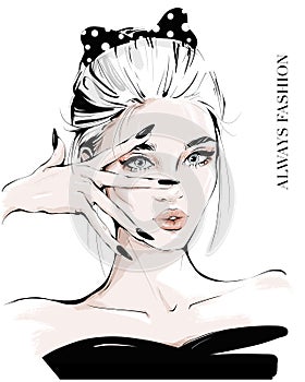 Hand drawn young woman with hand near face. Fashion girl with spotted black bow in her hair. Stylish woman. Sketch.