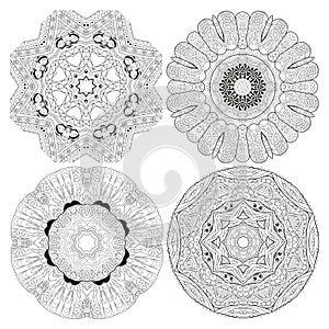 Hand drawn zentangle set of 4 mandalas for coloring page. photo