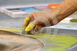 Hand Draws Chalk Art On Street At Fall Festival