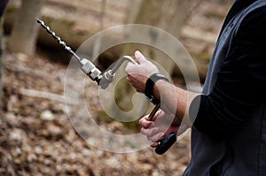 Hand drill for tapping trees
