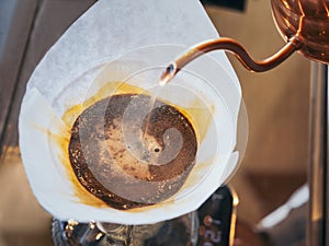 Hand drip coffee, Barista pouring water on coffee ground with filter