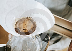 Hand drip coffee, Barista pouring water on coffee ground with filter