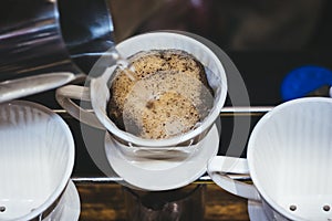 Hand Drip Coffee Pouring hot water on coffee ground