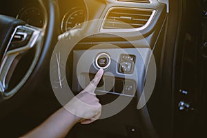 Hand driver push on car engine power system technology button,Finger pressing on start stop engine