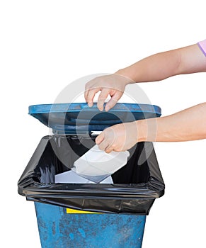 Hand dumping a foam of garbage