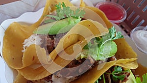 Hand eating corn tortilla carnitas taco Mexican poppular food 4k