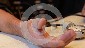 Hand of elderly man measuring arterial blood pressure. Health care in old age. Pensioner monitoring his blood pressure and pulse a