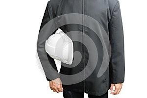 Hand of engineering worker holding white safety helmet plastic. in construction isolated on white background