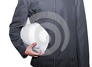 Hand of engineering worker holding white safety helmet plastic. in construction isolated on white background