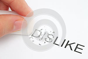 Hand erasing part of the dislike word