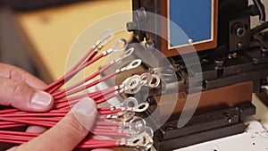 Hand examine electric wire connector terminals - close up