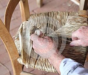Hand of an expert stuffing chair