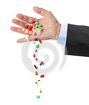 Hand and falling pills