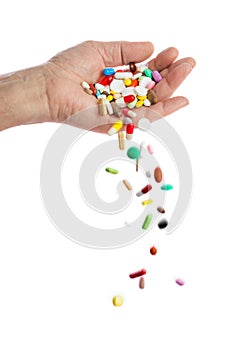 Hand and falling pills