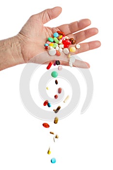 Hand and falling pills