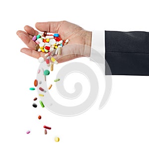 Hand and falling pills