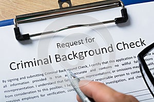 Hand Filling Criminal Background Check Application Form