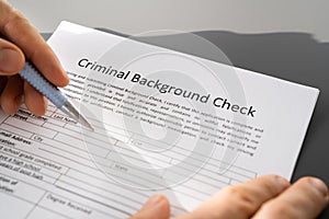Hand Filling Criminal Background Check Application