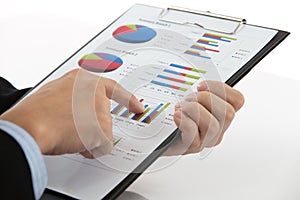 Hand with finance report