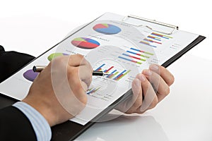 Hand with finance report