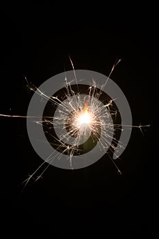 Hand fireworks sparkler on black background