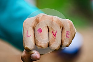 Hand fist write love