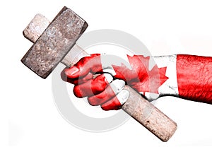 Hand with flag of Canada handling a heavy hammer