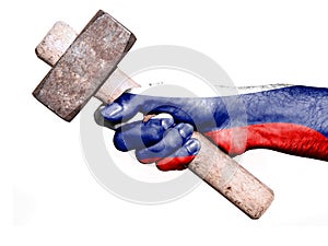 Hand with flag of Russia handling a heavy hammer