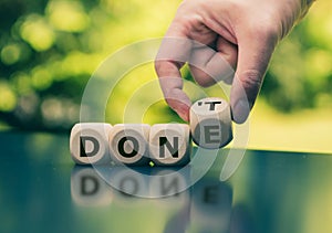 Hand flips a cube and changes the expression `don`t` to `done`