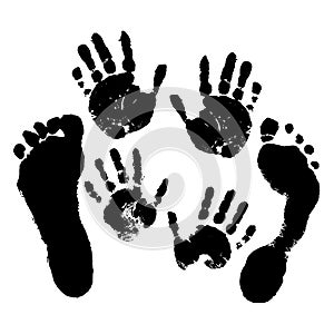 Hand and footprints of adults and children on a white isolated background.