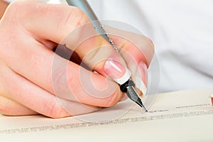 Hand with fountain pen writes under contract photo