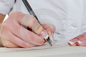 Hand with fountain pen writes under contract photo