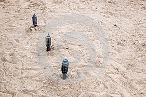 hand fragmentation grenade mounted on the sand in a stretch