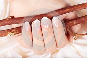 Hand with french manicured nails