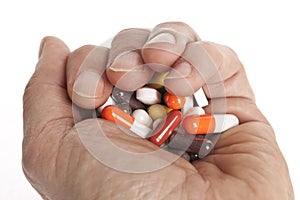Hand full of different tablets